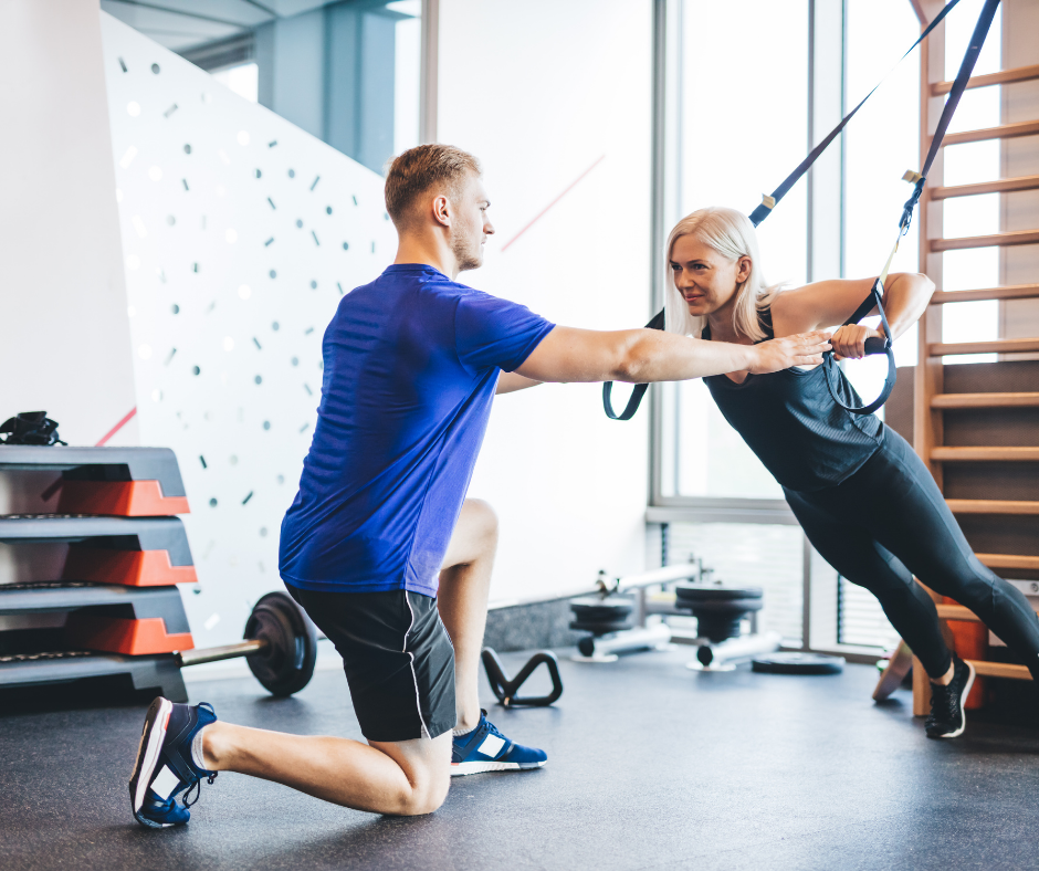 Exercising with personal trainer.
