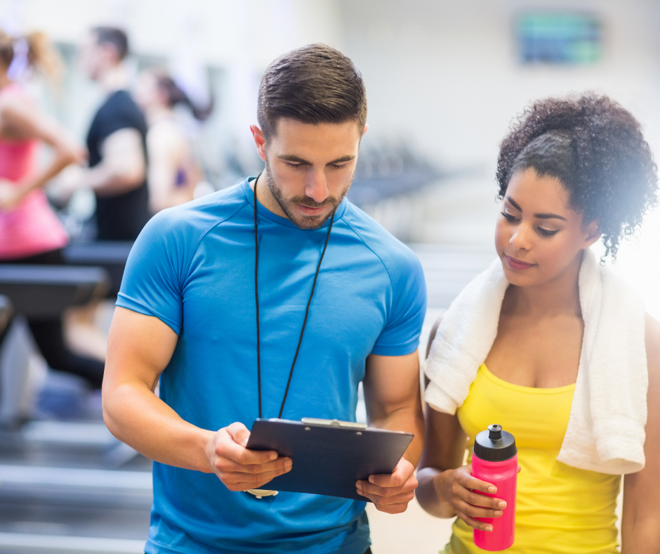 Personal trainer with a customer.