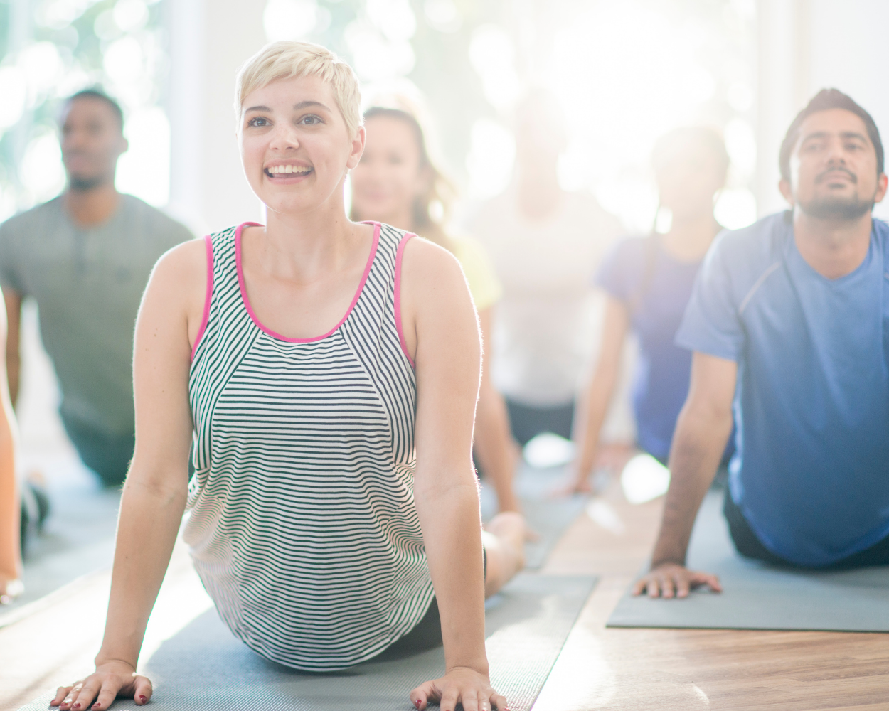 Woman with short hair doing yoga.